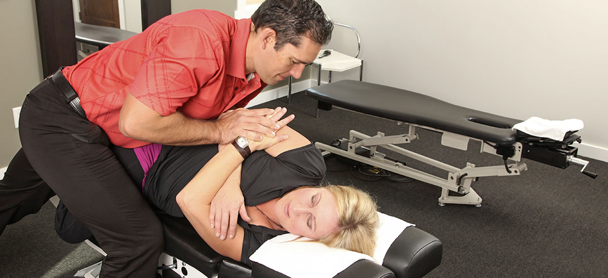 Chiropractor performing an adjustment